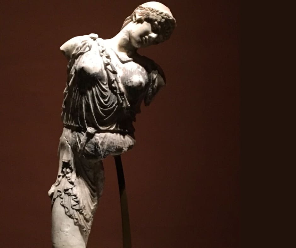 Classical marble statue demonstrating how art endures even when damaged, maintaining dignity through time